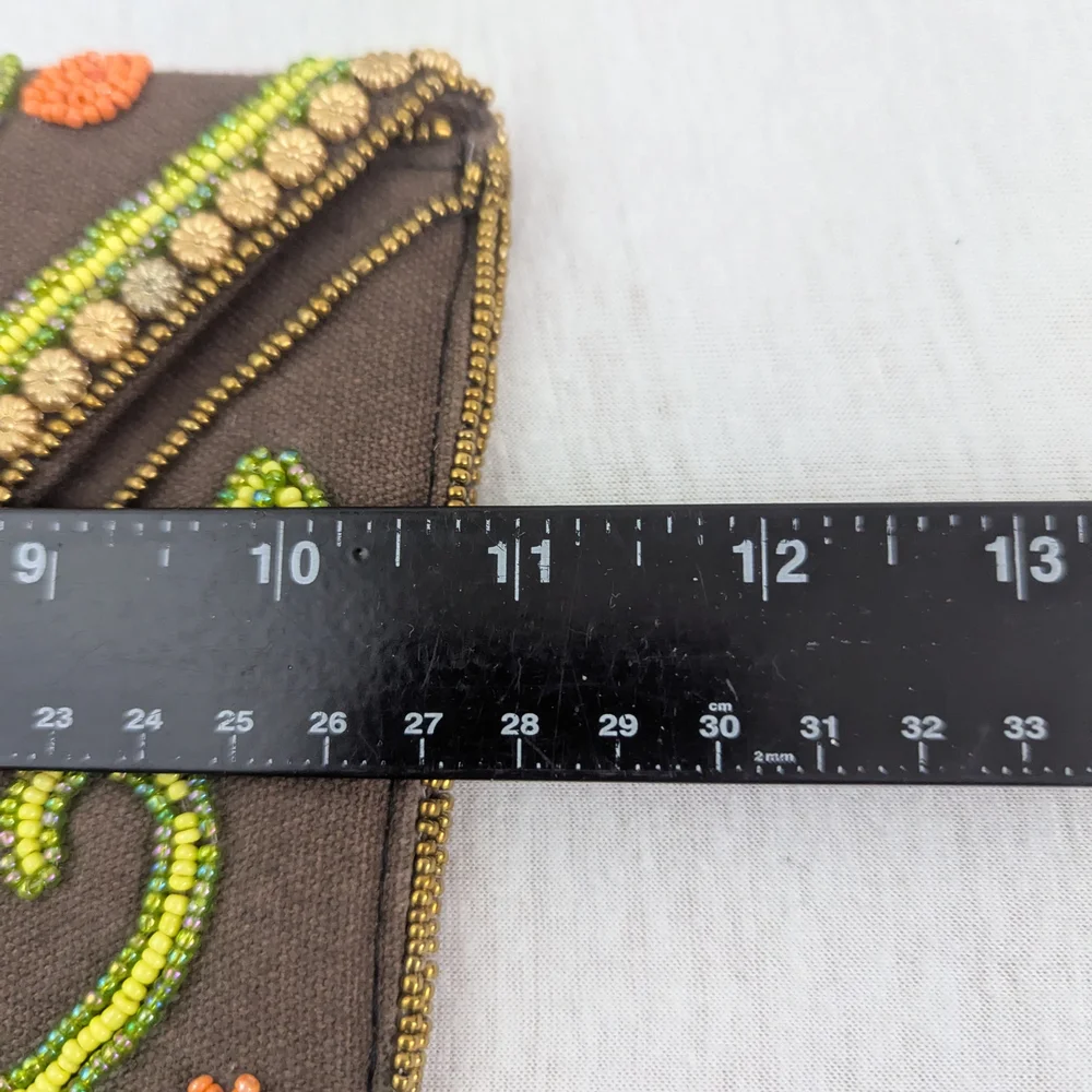 Coomi vibrant clutch