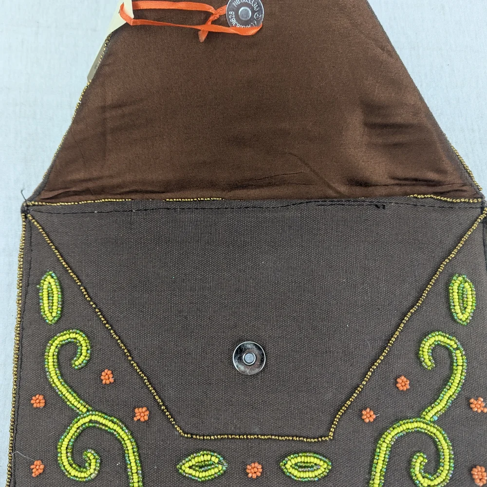 Coomi vibrant clutch