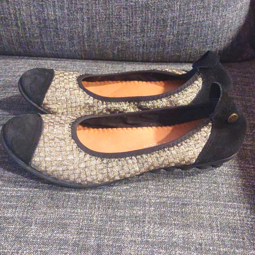 Gold and black flats