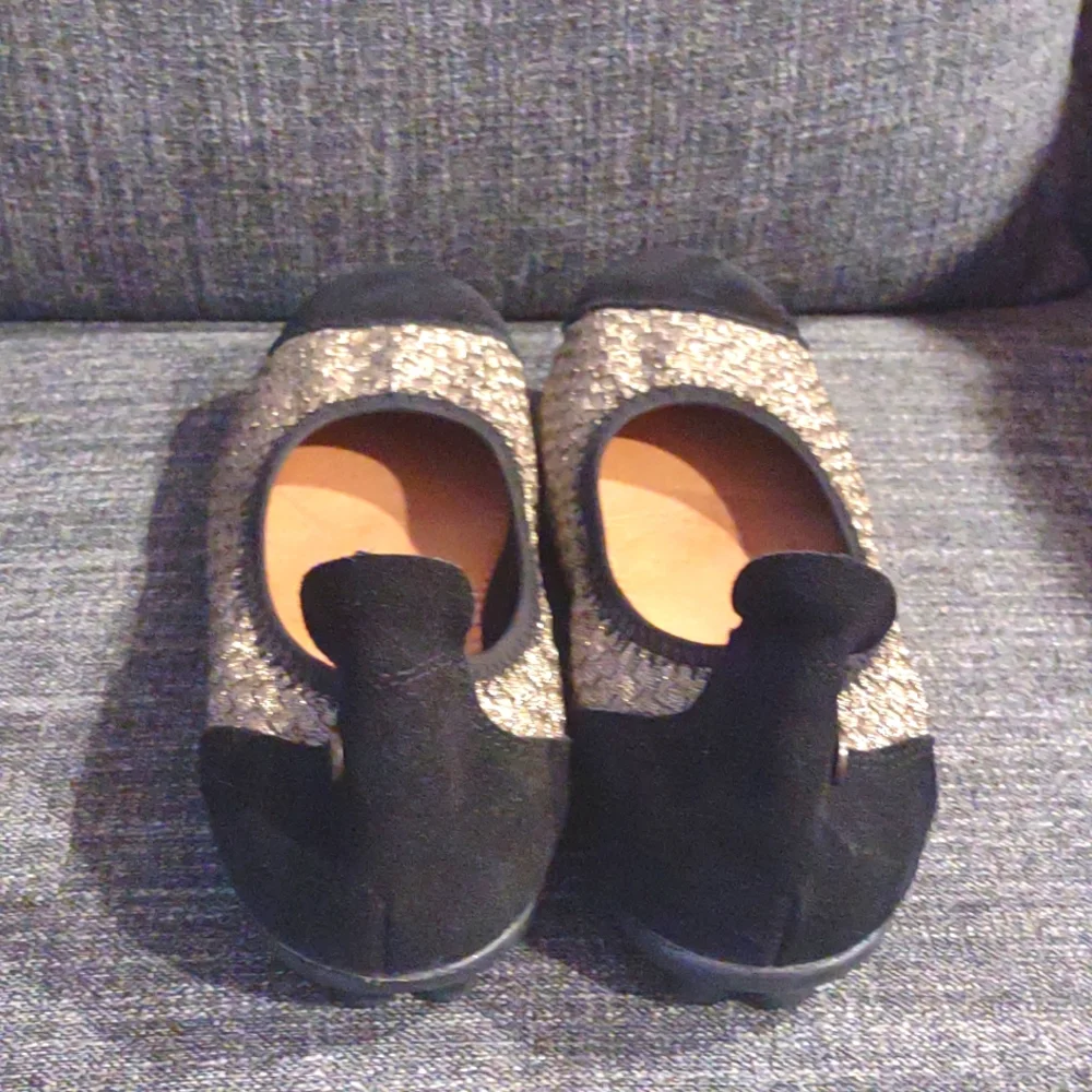 Gold and black flats