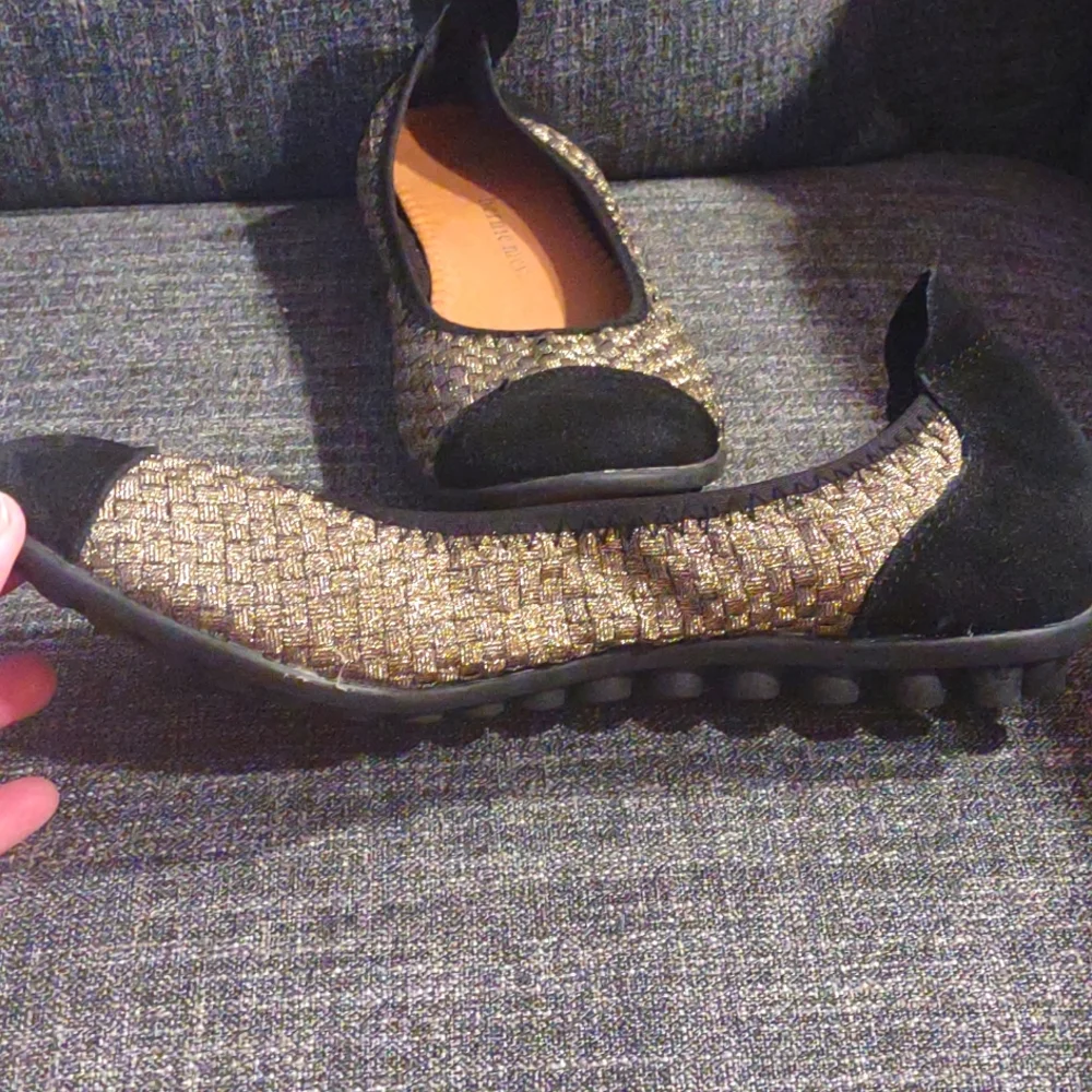 Gold and black flats