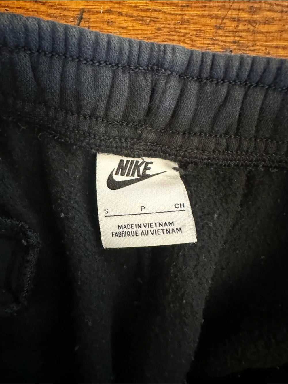 Nike black sweatpants with white logo,