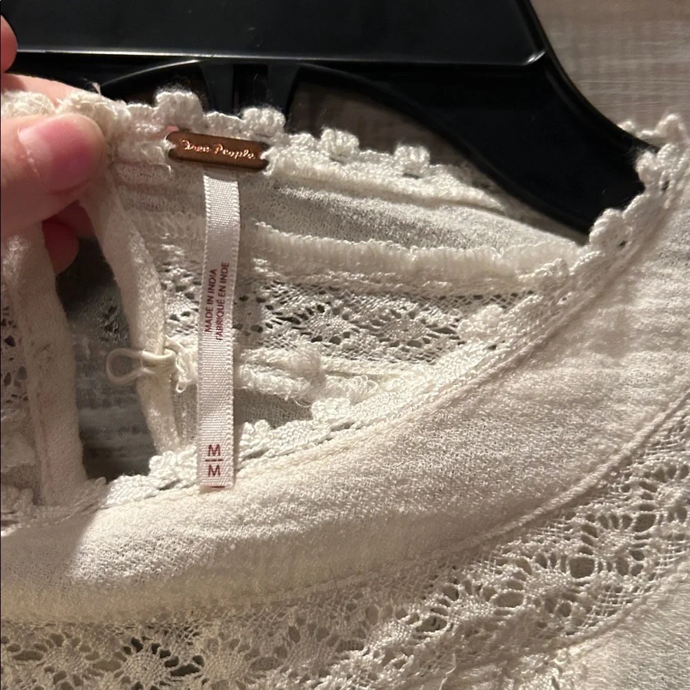 Free People features cream embroidery
