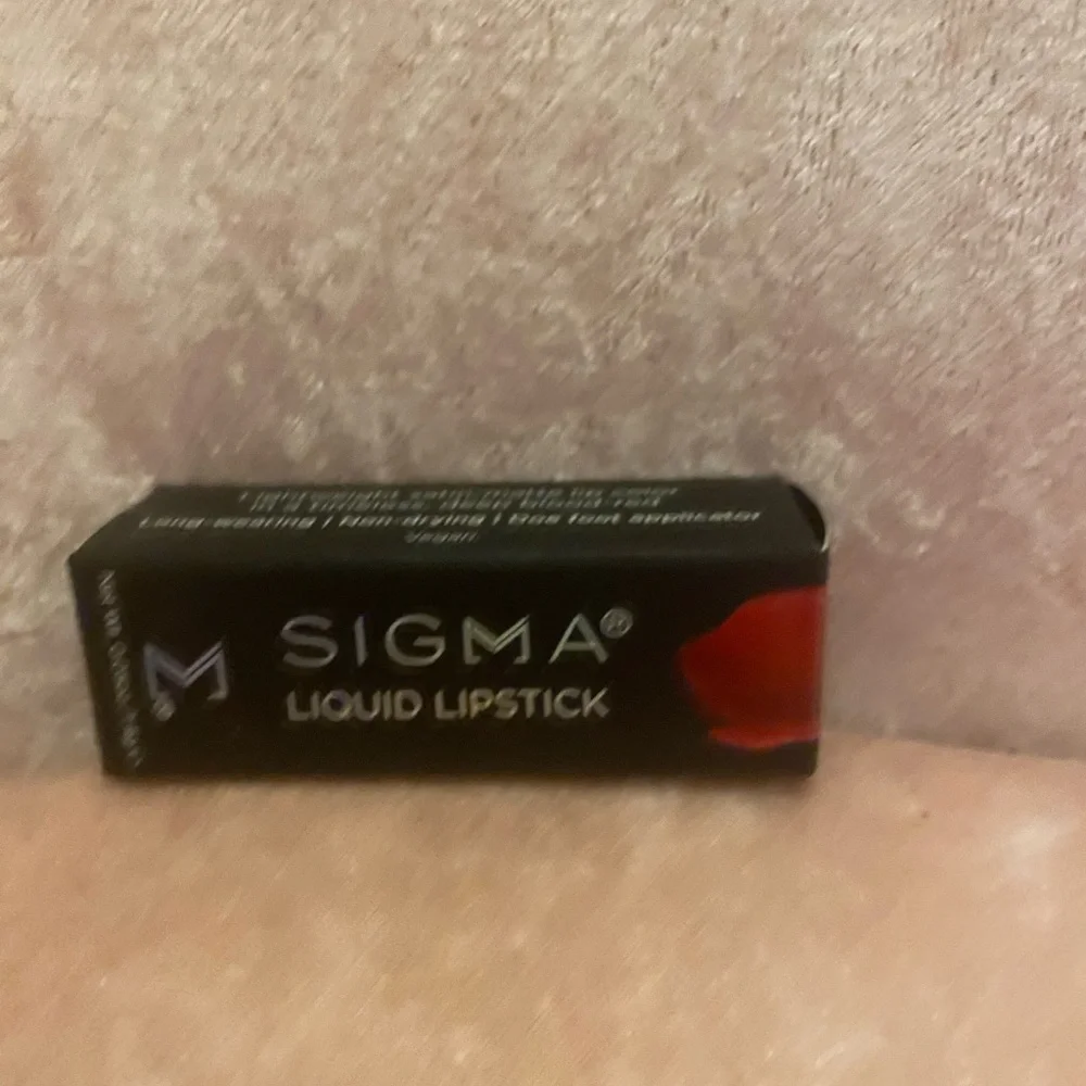 Travel size Sigma liquid lipstick 💄 in the color Venom (red)