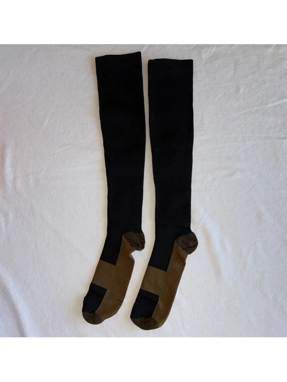 Men’s copper/compression socks. Reinforced heel dress style, black and brown.