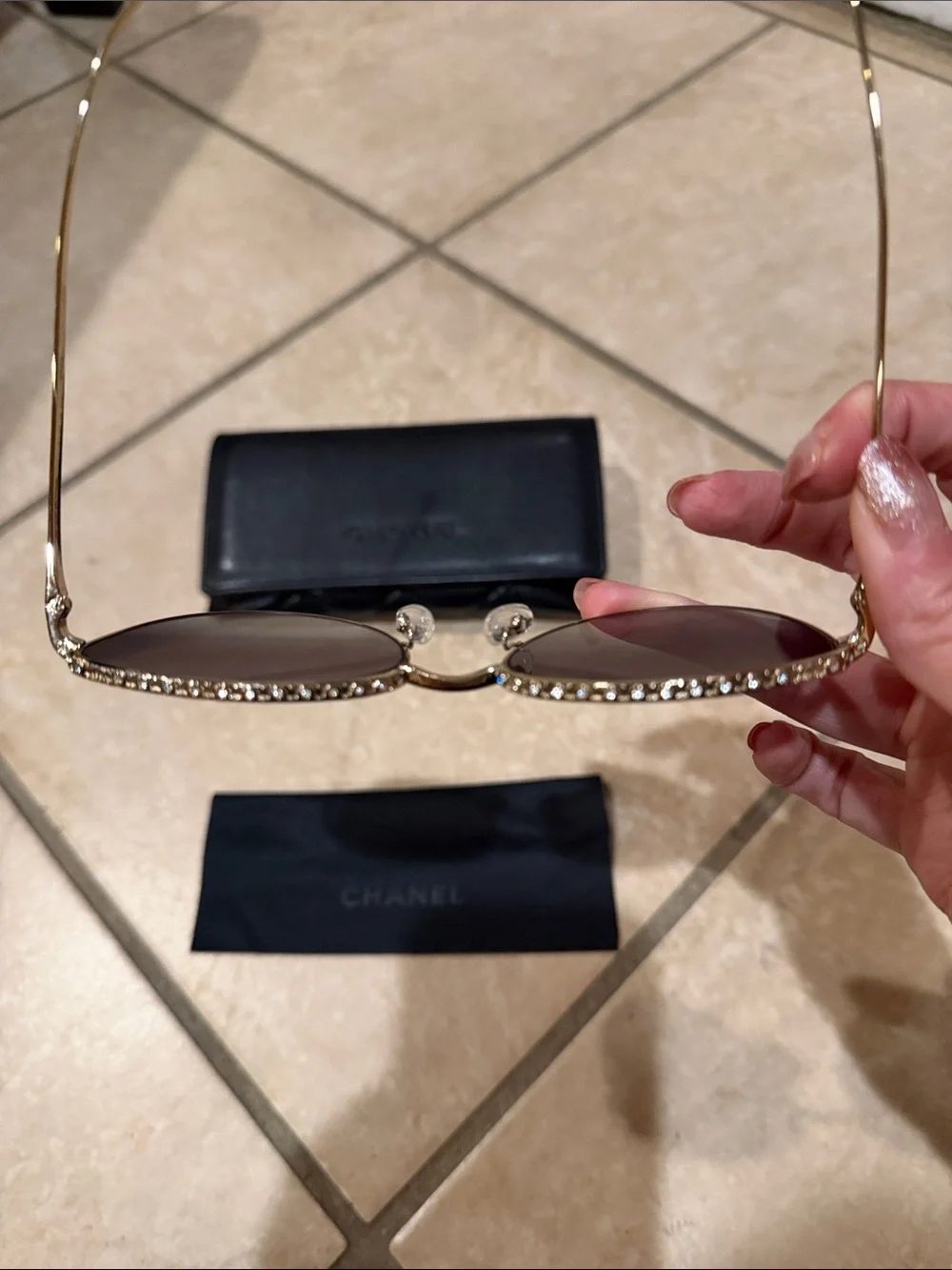 CHANEL sunglasses featuring