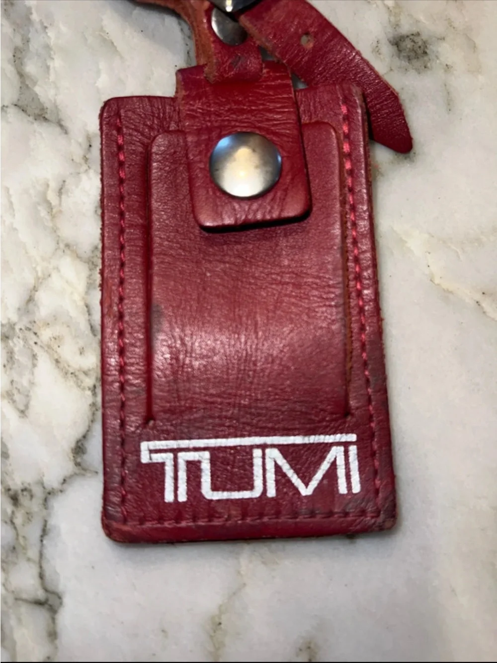 Tumi leather luggage