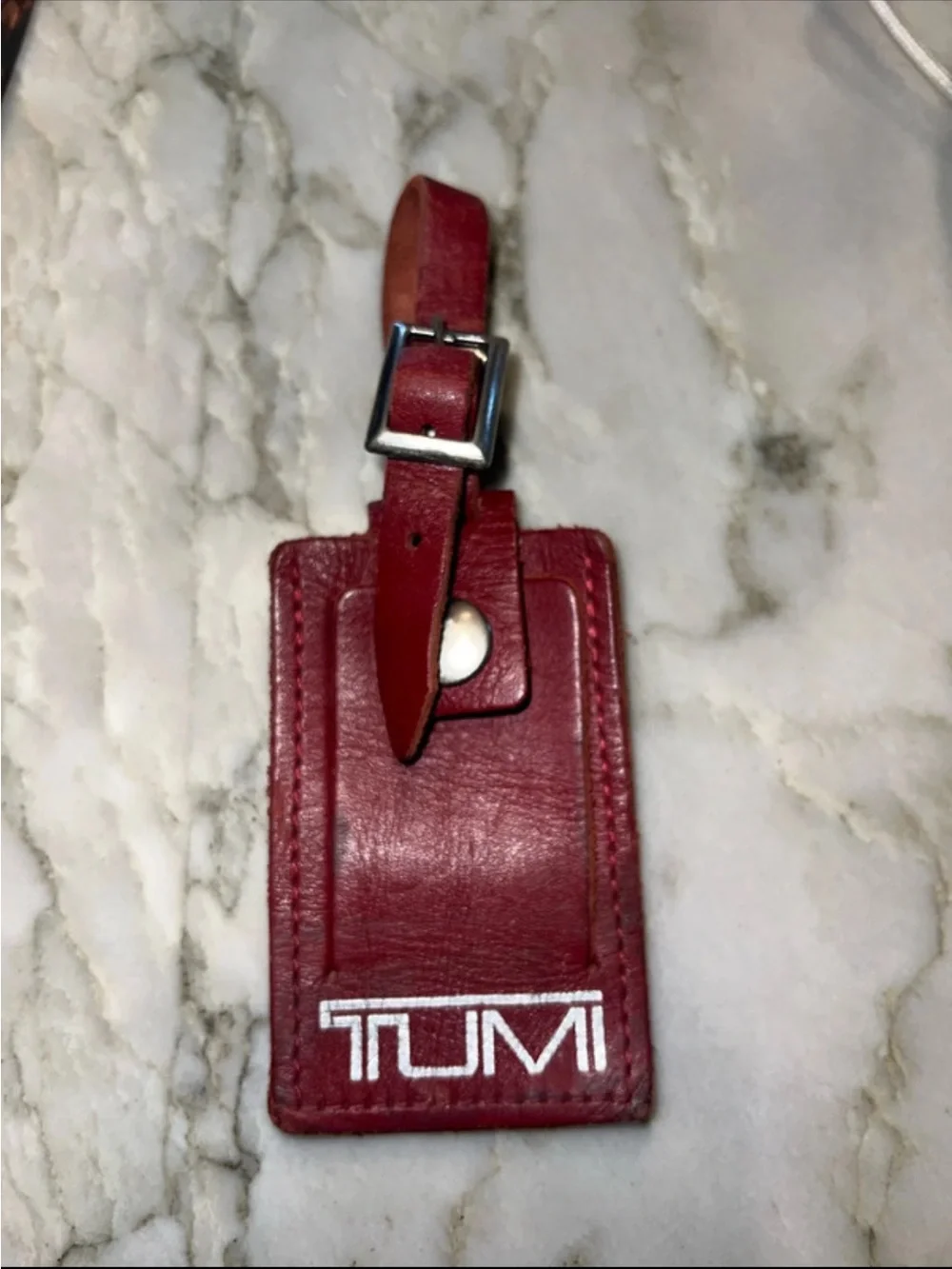 Tumi leather luggage