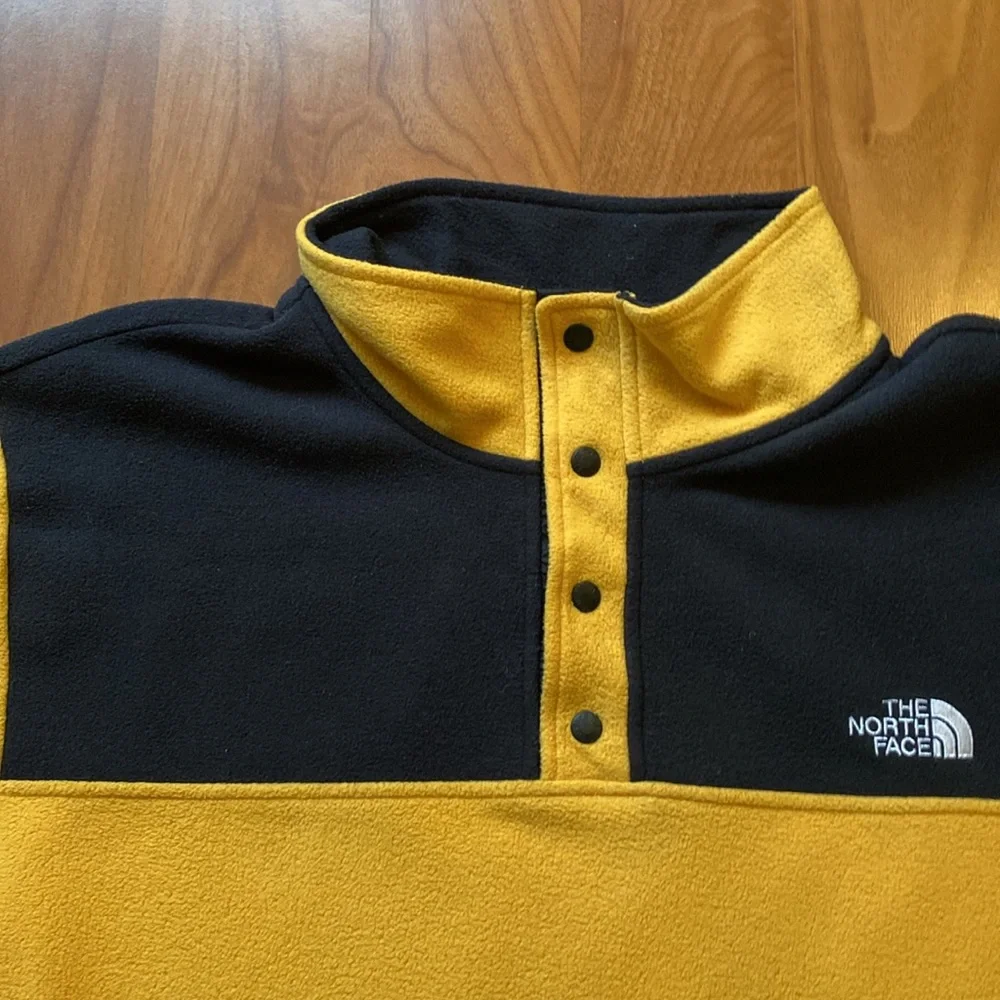 The North Face gold black