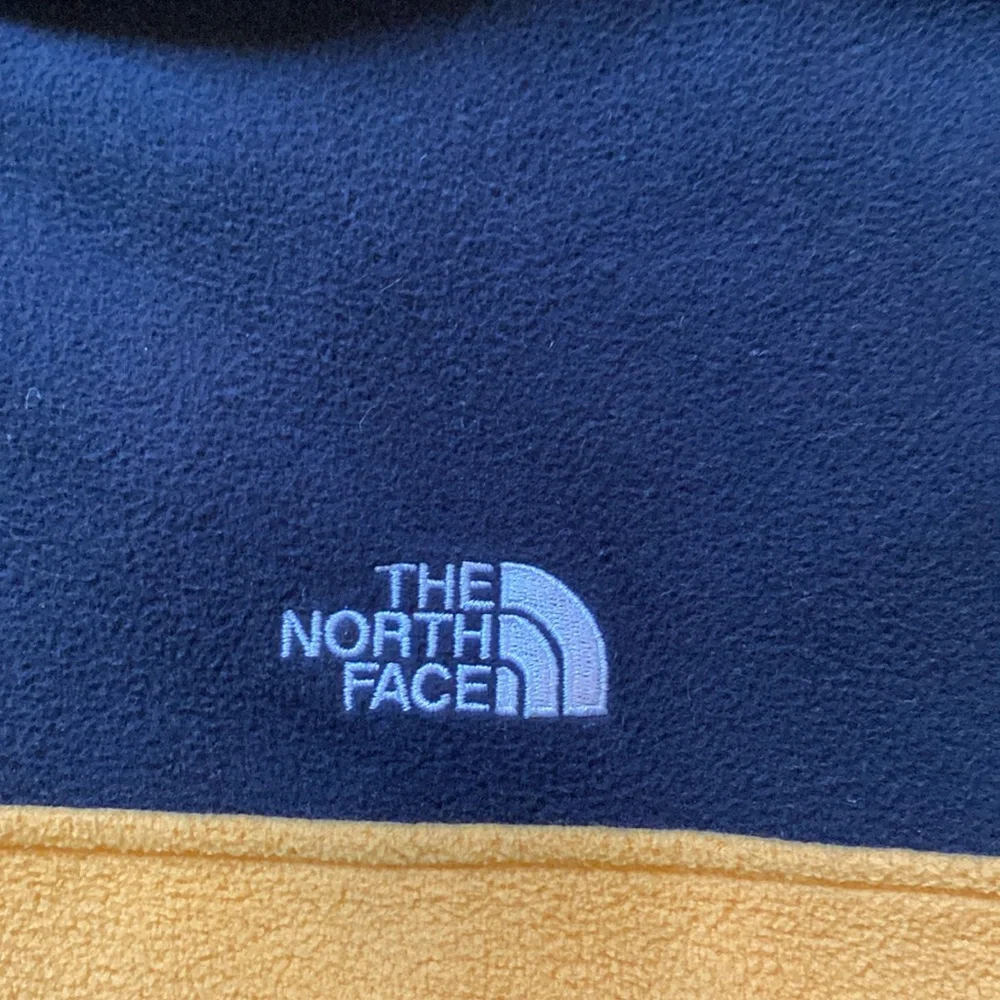 The North Face gold black