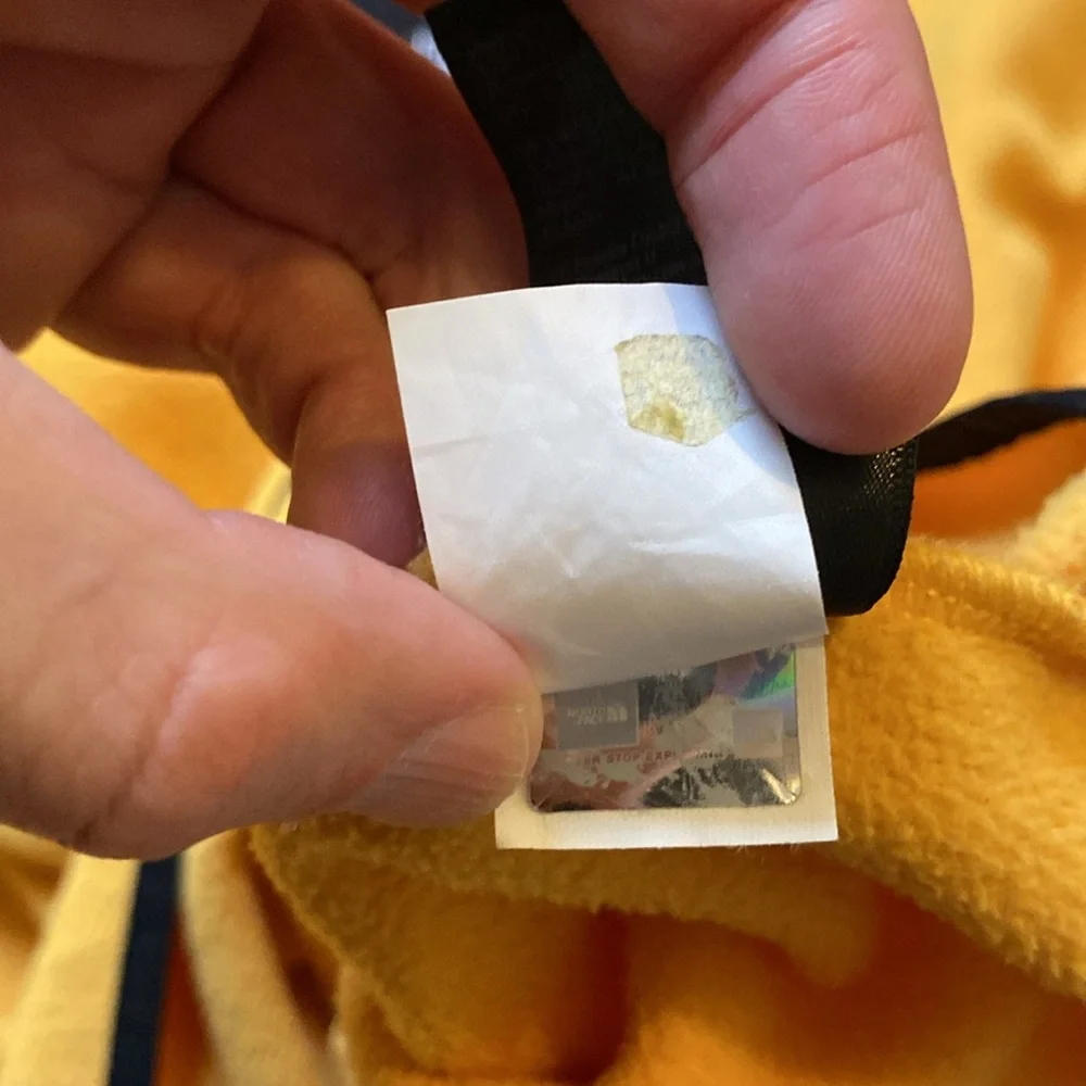 The North Face gold black