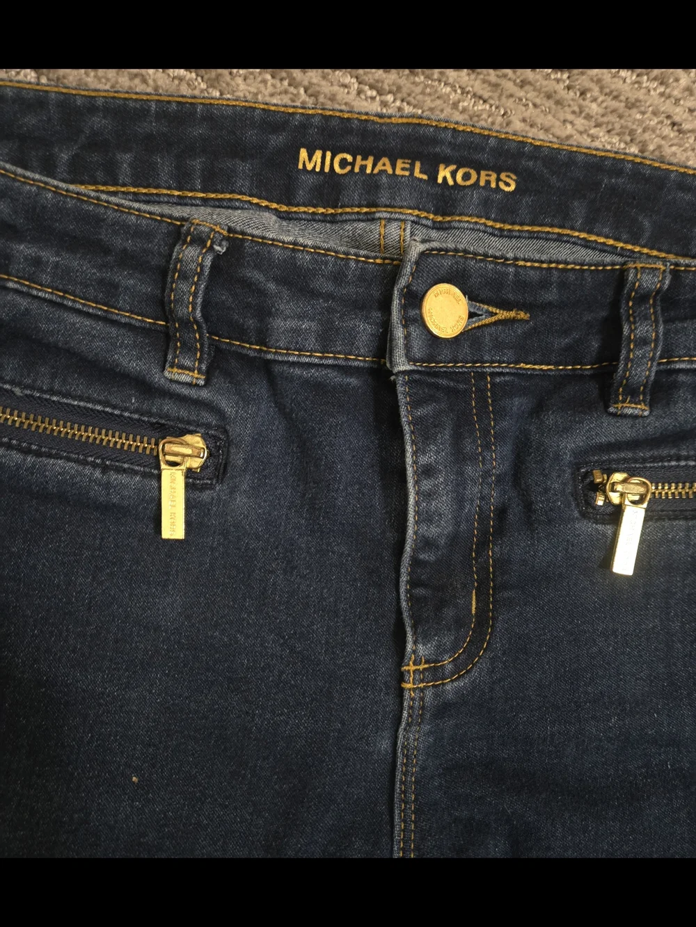 Michael Kors Women's Dark Blue Denim Jeans with Gold Hardware