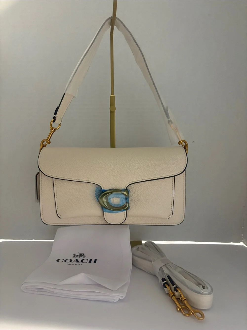 Coach Cream Pebbled Leather Clutch with Gold 'C' Accent