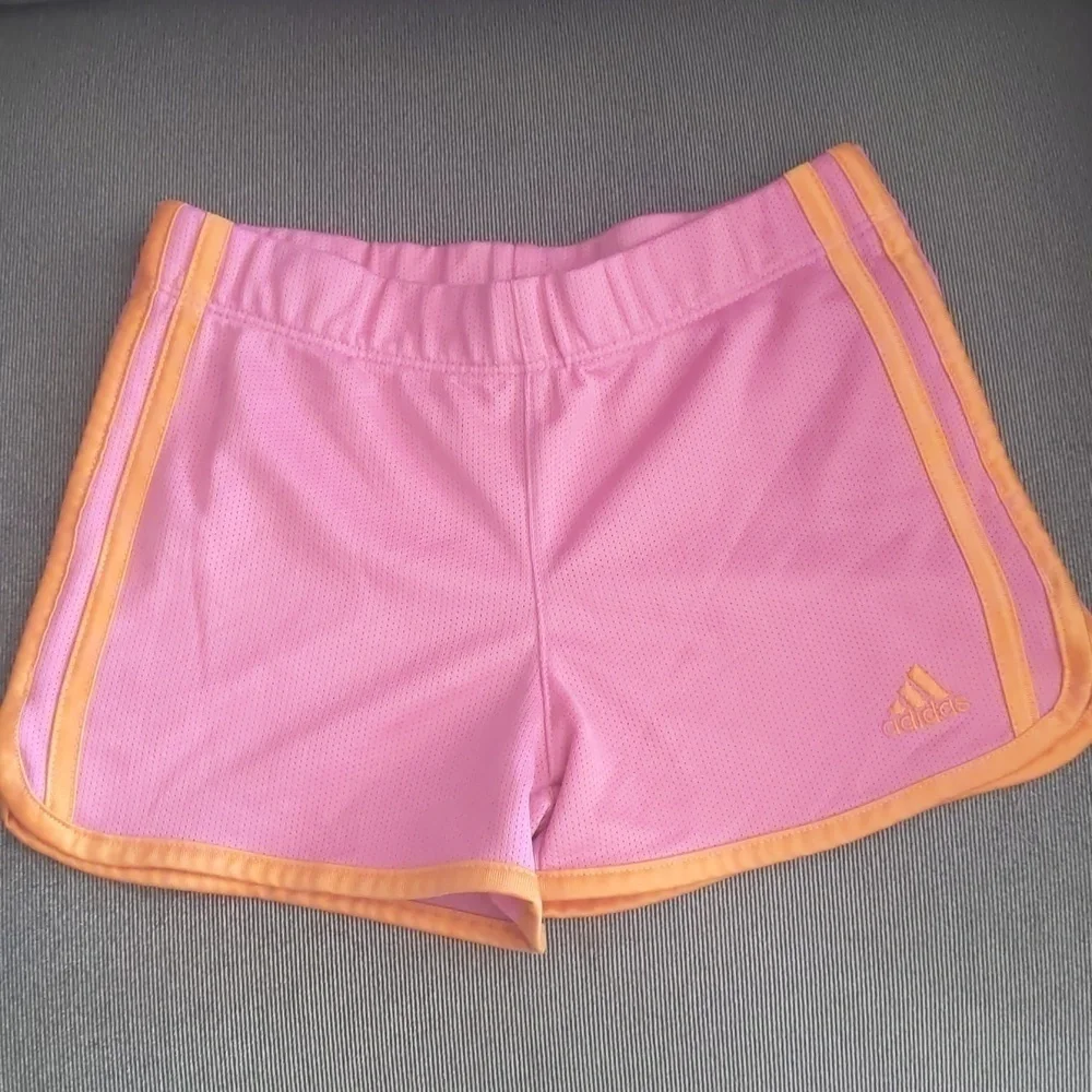 Girl's Adidas shorts size 6. Orange and pink.