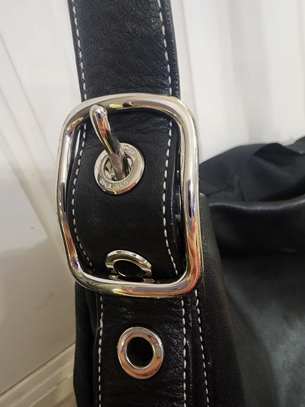 Coach old sleek stitching