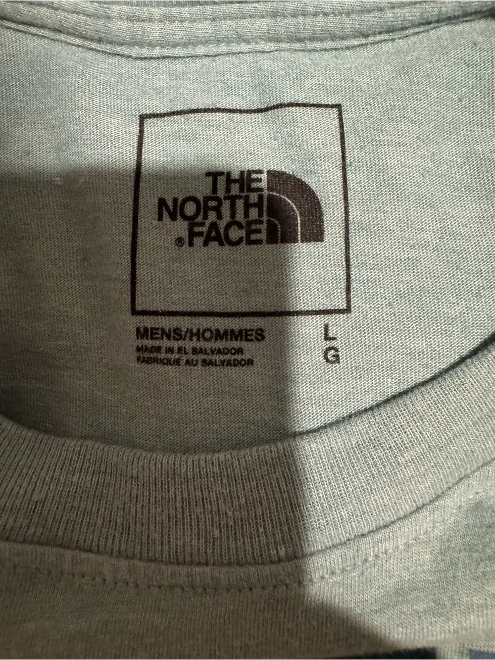 The North Face teal graphic sleeve