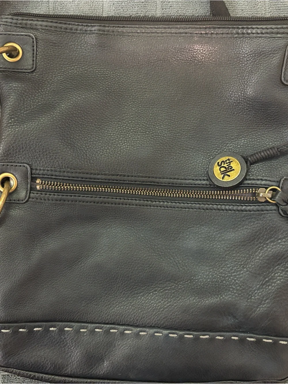 The Sak Black Leather Messenger Bag with Gold Hardware