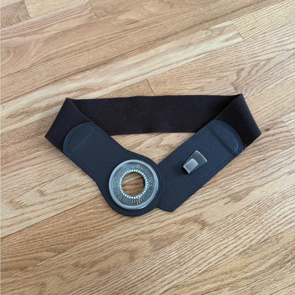 brown elasticated waist cinch belt with a circular buckle
