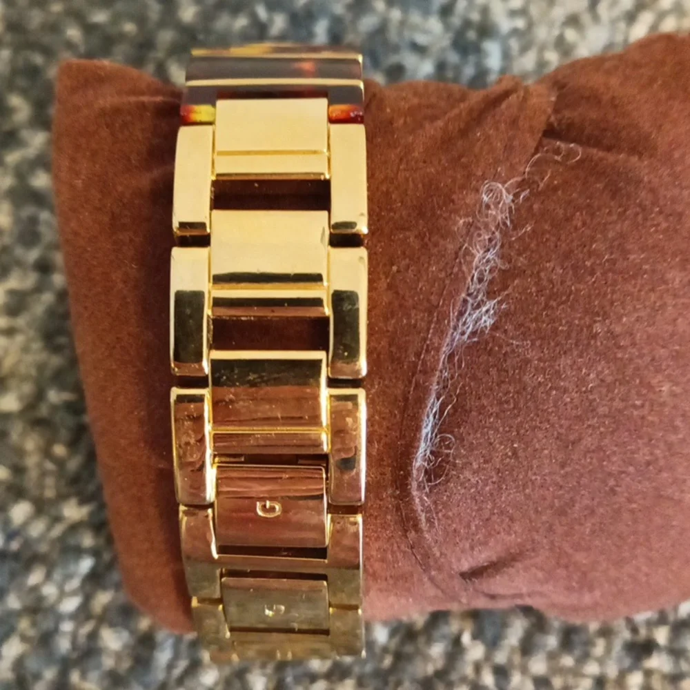 Guess gold tone