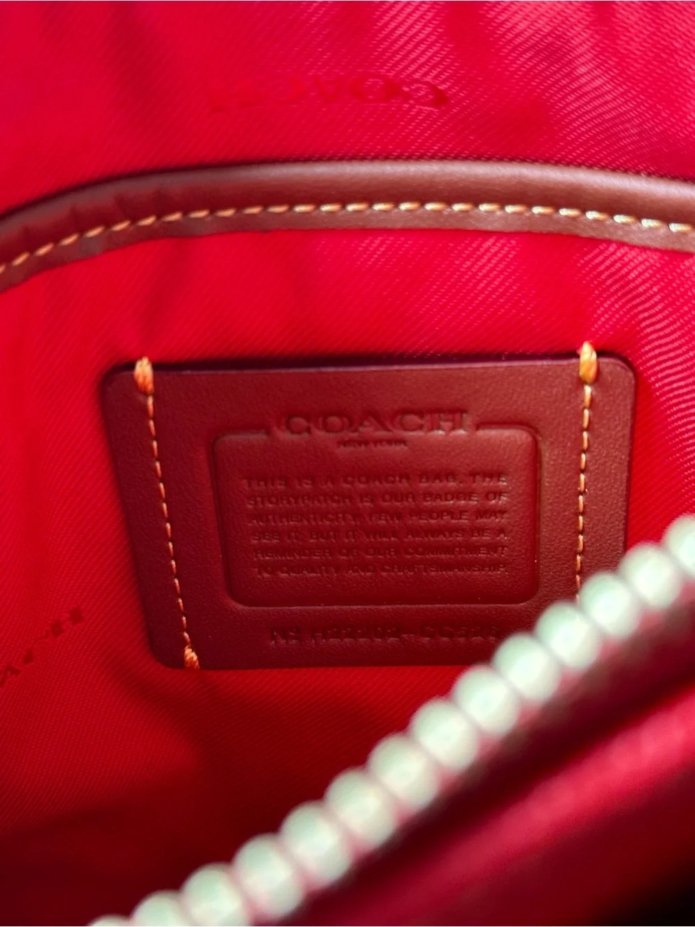 Coach compact pebbled
