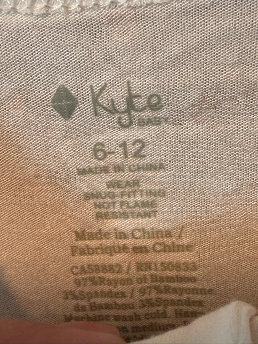 Kyte BABY Cream Footed One-Piece with Orange Star Motif