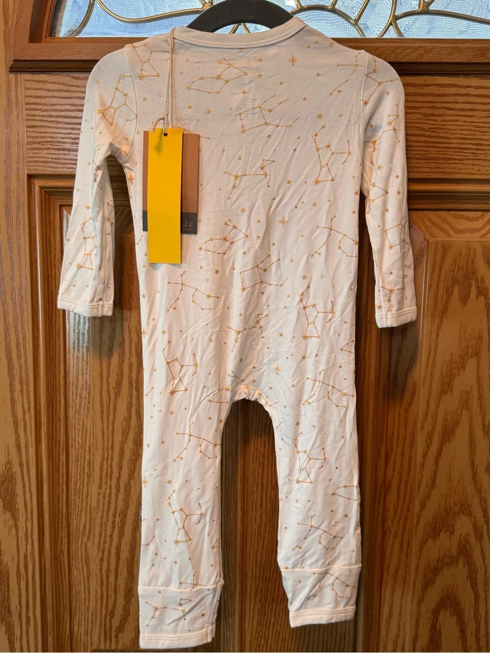 Kyte BABY Cream Footed One-Piece with Orange Star Motif