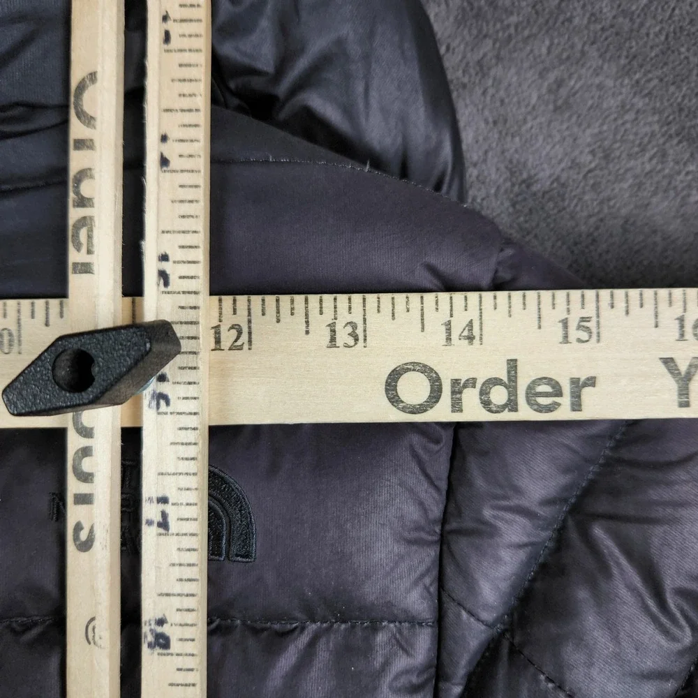 The North Face magnetic button