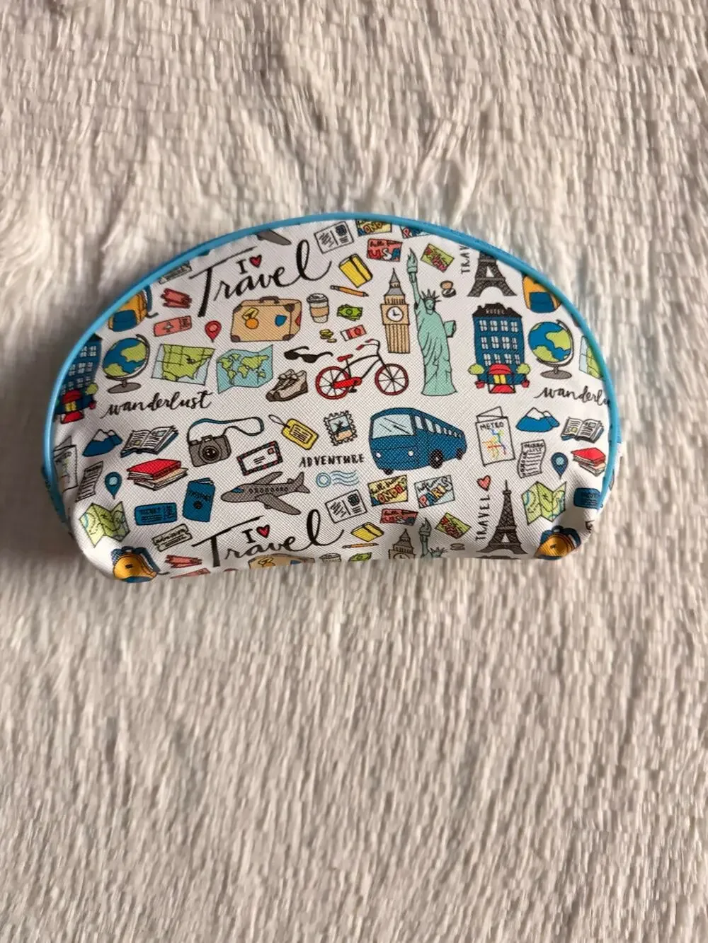 Travel-themed makeup bag/pencil pouch blue trim and travel-related illustrations