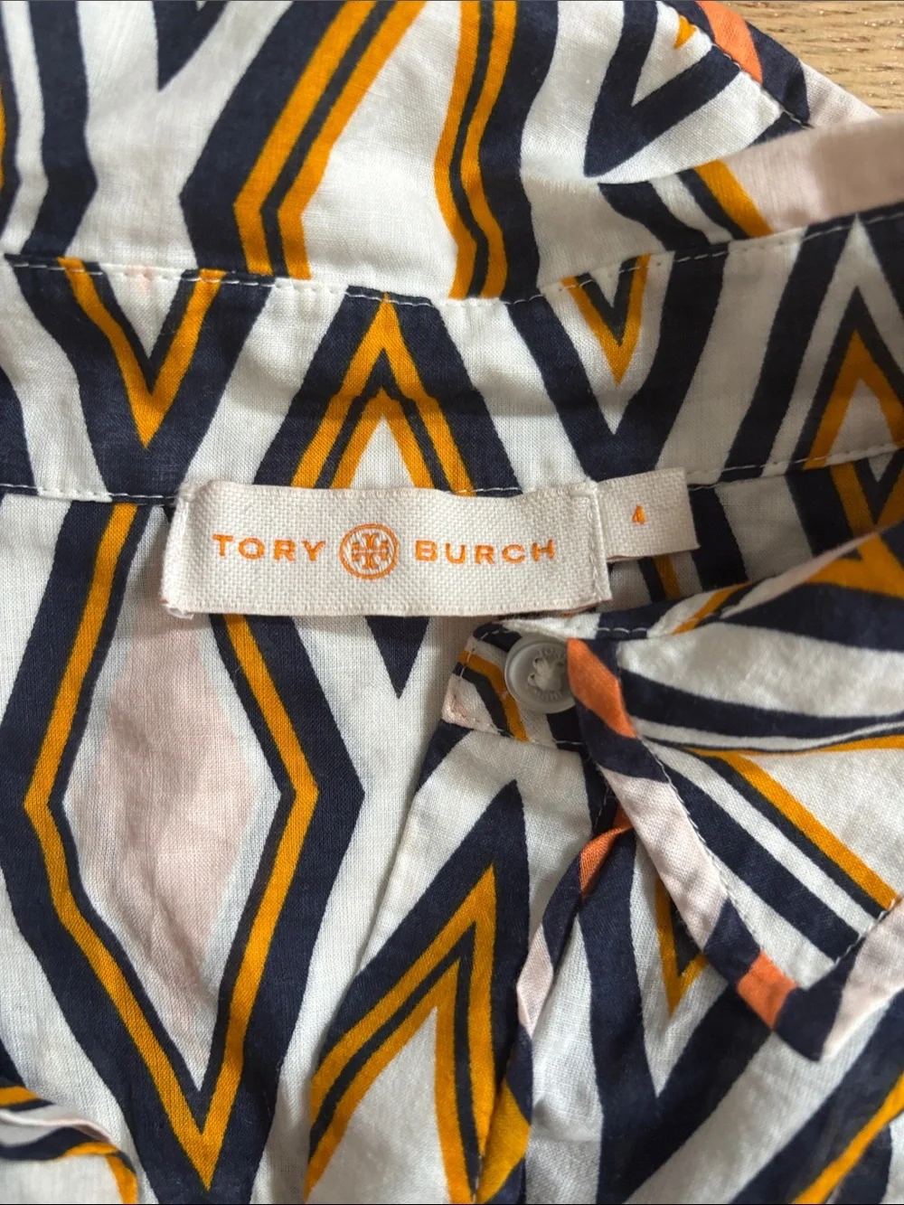 Tory Burch pocket down button