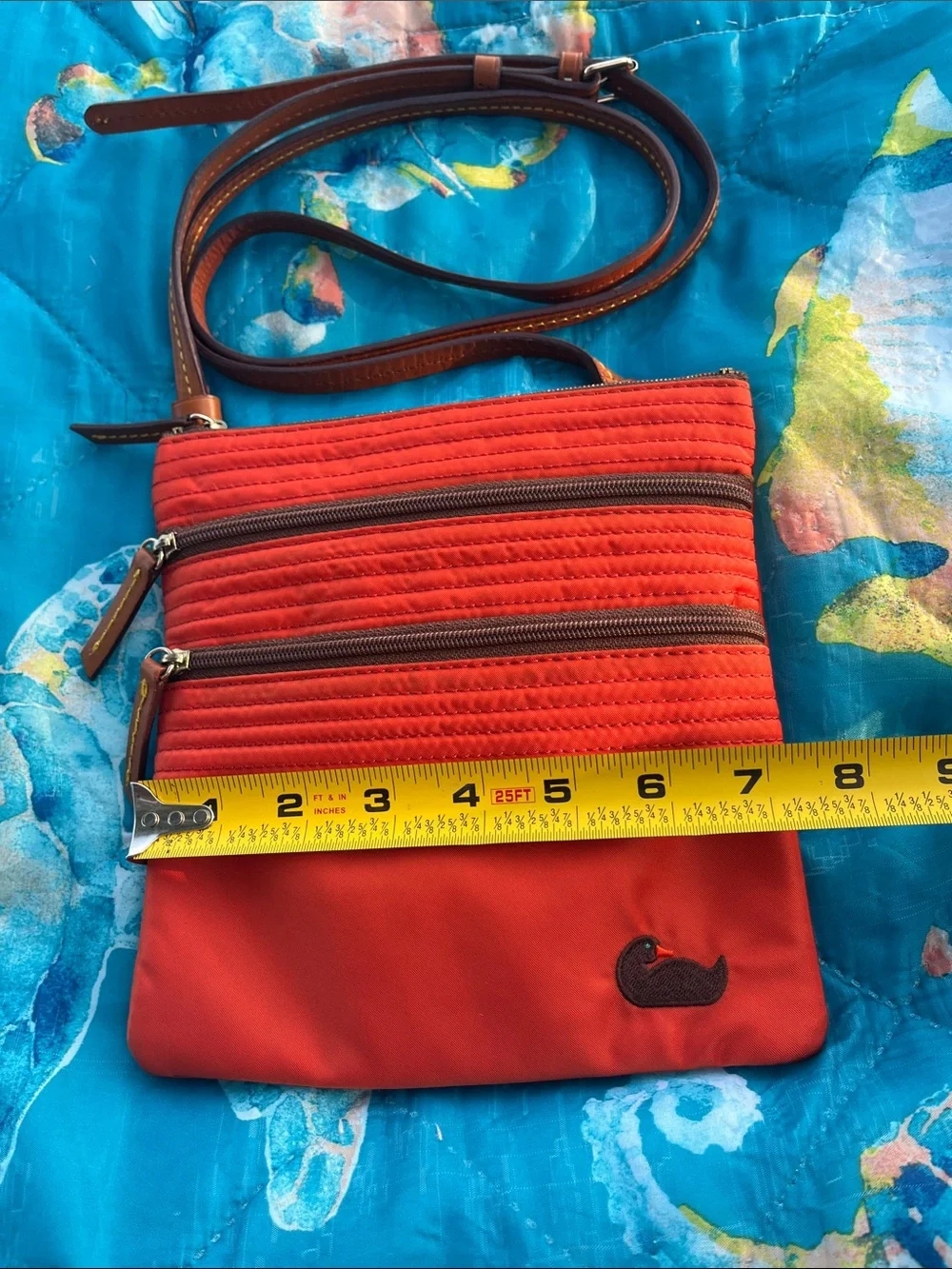 Dooney & Bourke adjustable zip compact