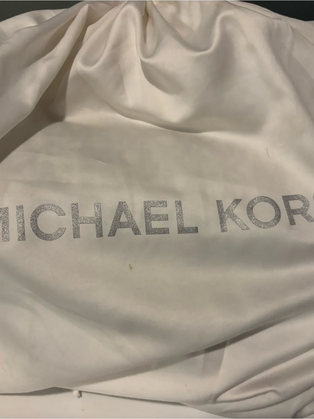 Michael Kors handles logo