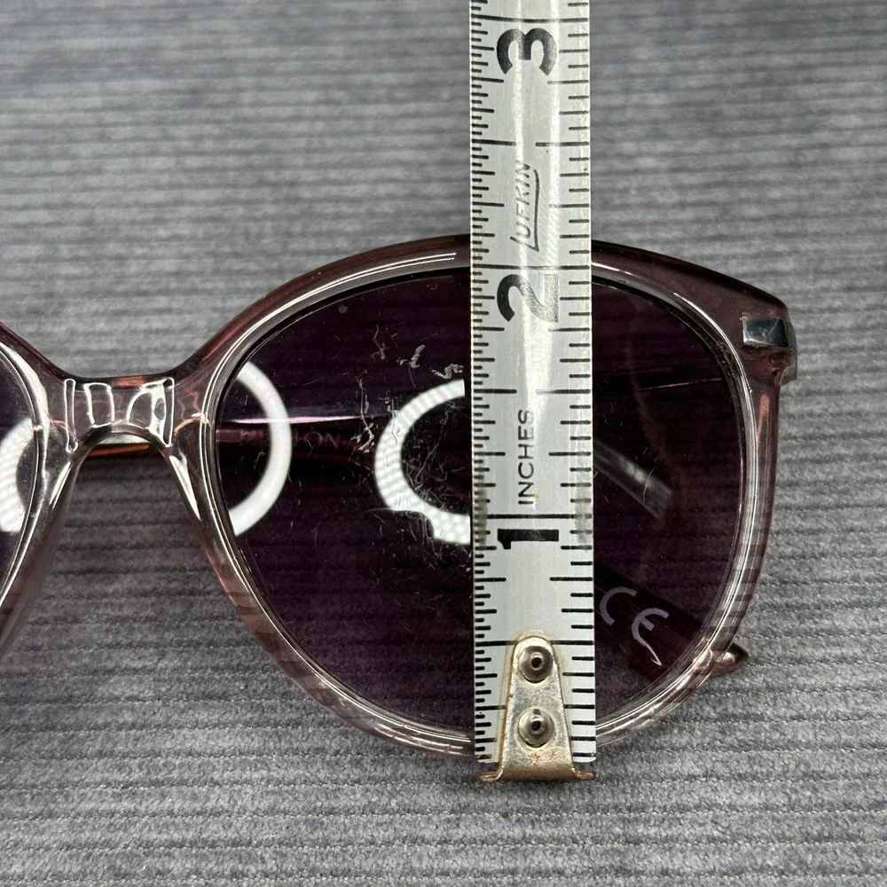 Revlon sunglasses featuring