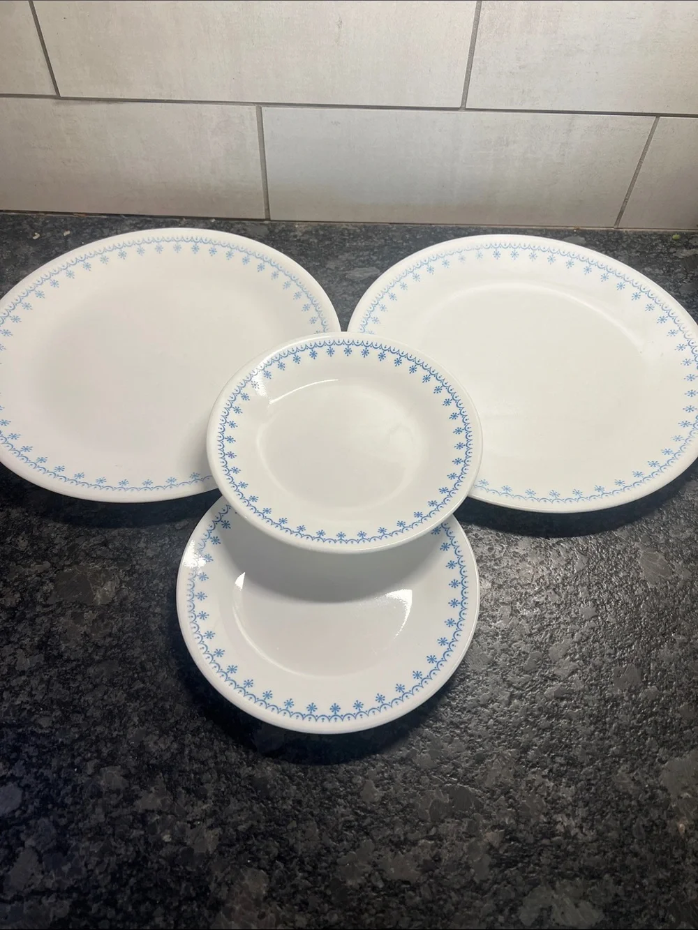 4 piece set of Corelle Dinner plates and salad plates. Snowflake Blue