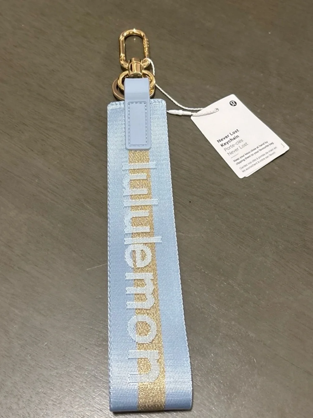 lululemon athletica light blue keychain wristlet with gold stripe