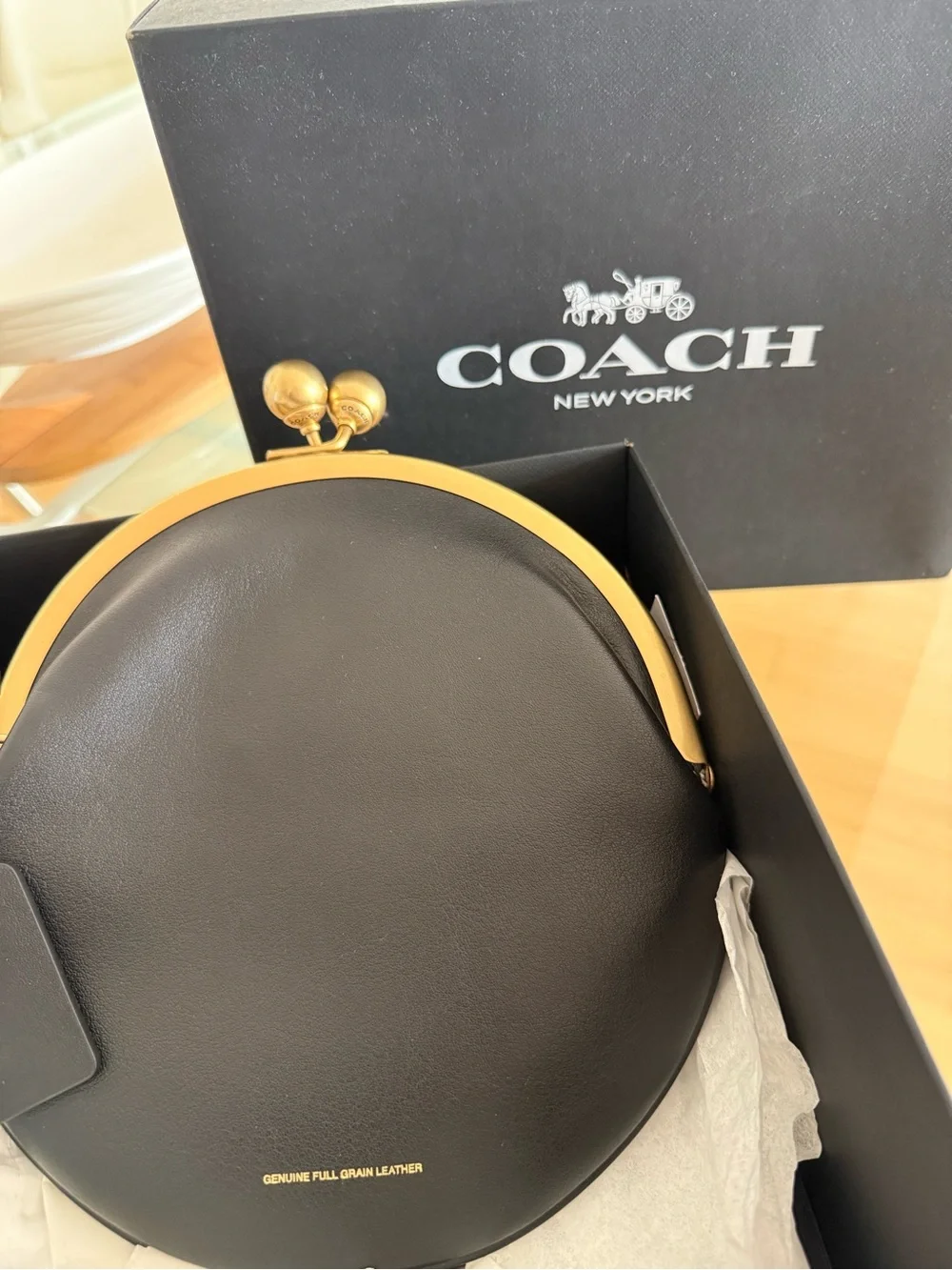 Coach round leather