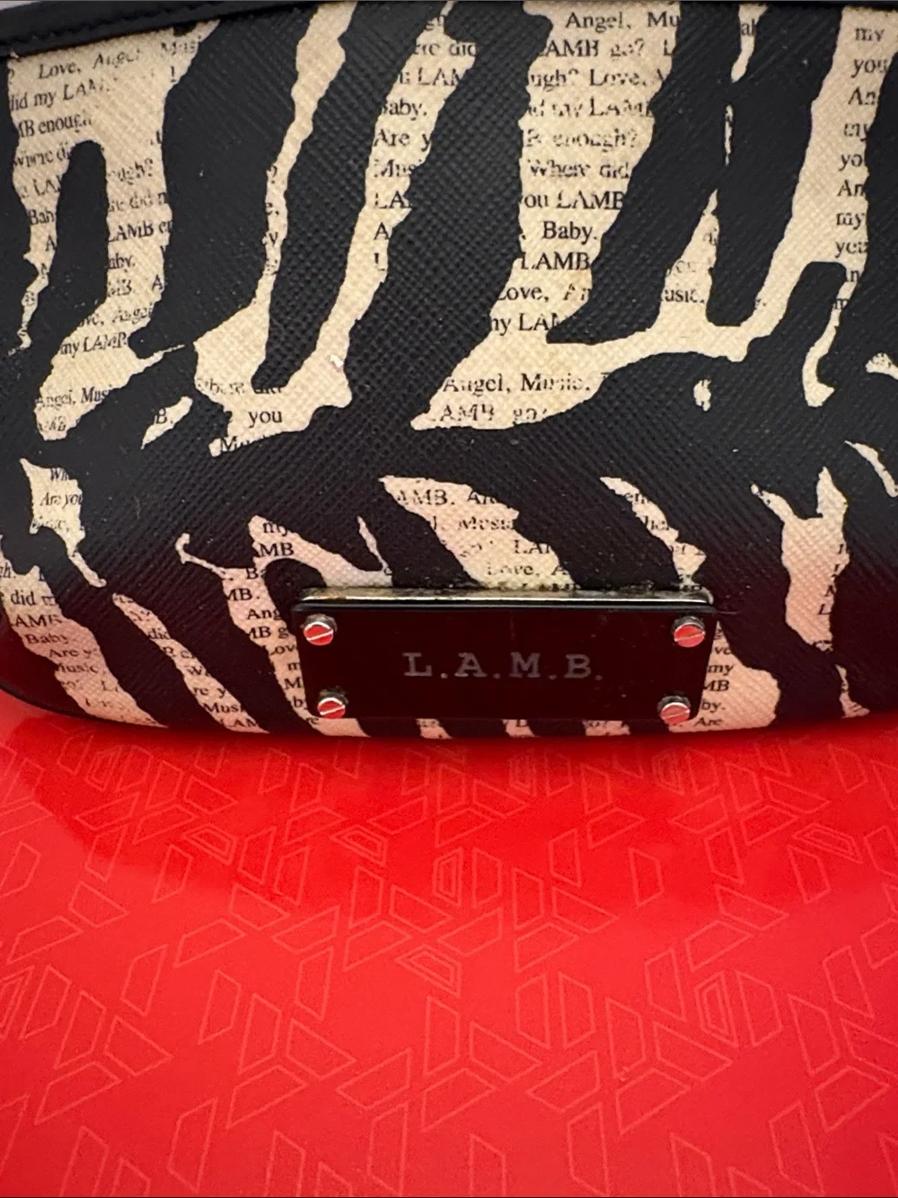 L.A.M.B. clutch featuring