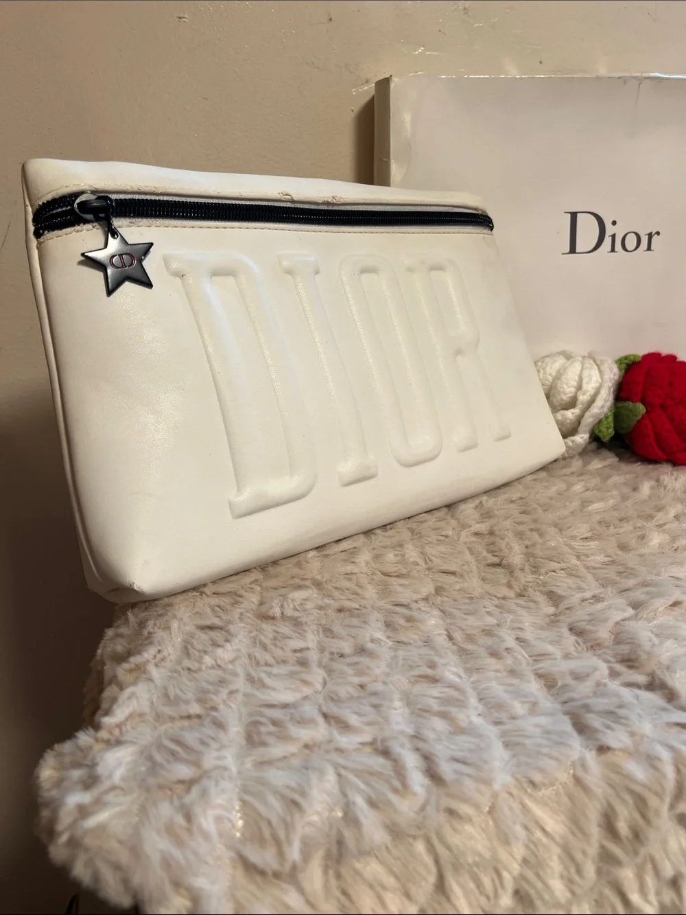 Dior Embossed Logo Cosmetic Case with Pom-Pom & Star Charm