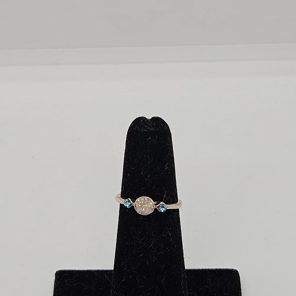gold tone ring with aqua and milky yellow rhinestones size 4.25