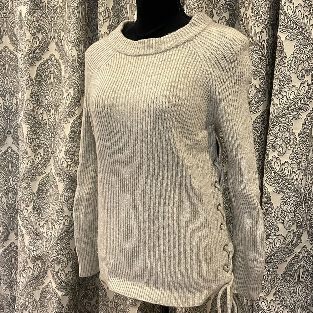 Gray crewneck sweater with lace up detail