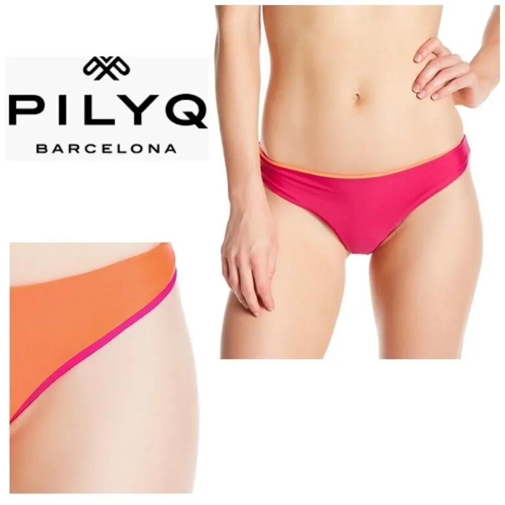 PILYQ bright orange/fuchsia reversible bottoms. Large