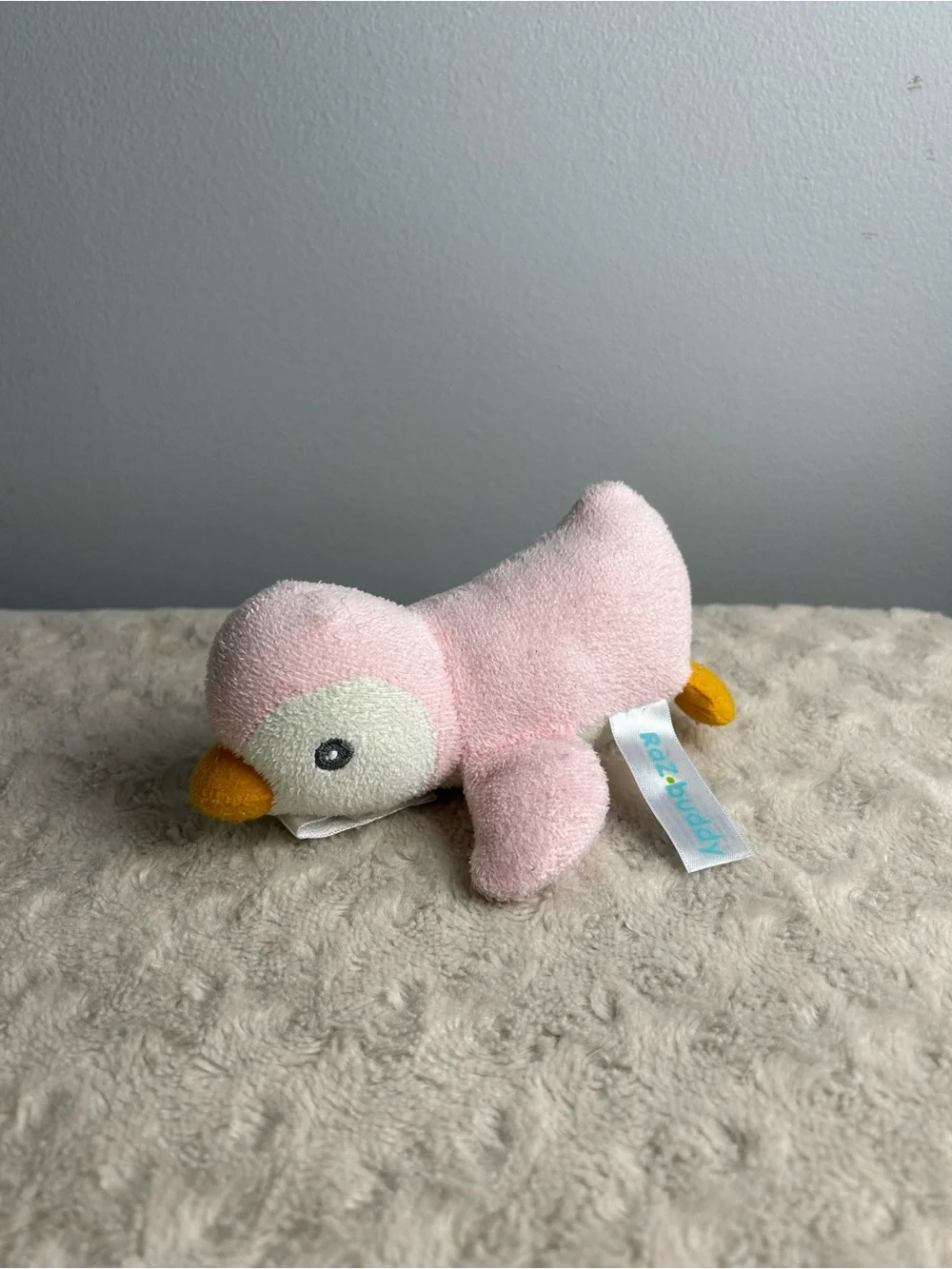 RaZbuddy Pink Penguin Plush Pacifier Holder White Orange RaZbaby Lovey