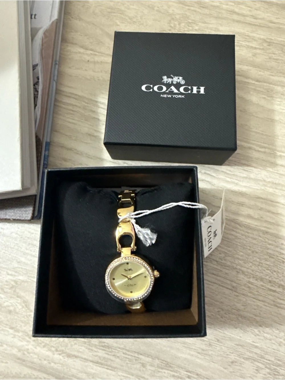 Coach polished gold