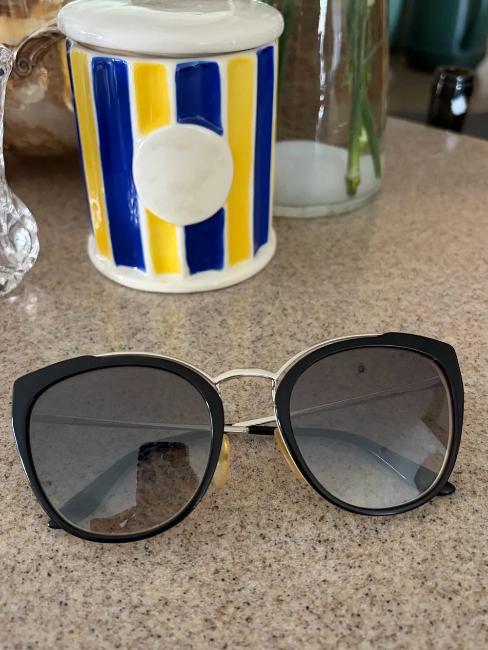 Prada Black and Gold Cat-Eye Sunglasses with Gradient Lenses