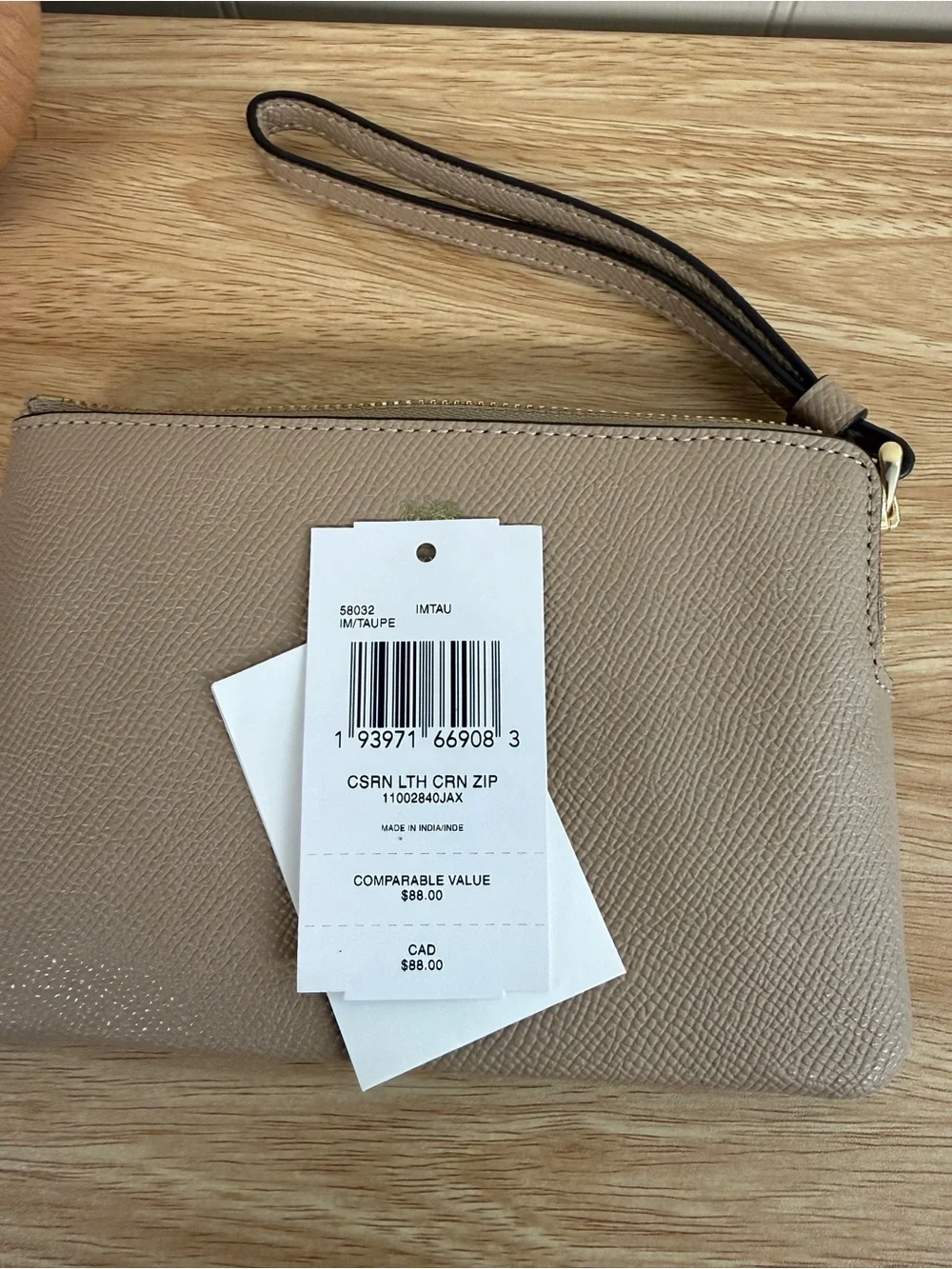 Coach wristlet taupe
