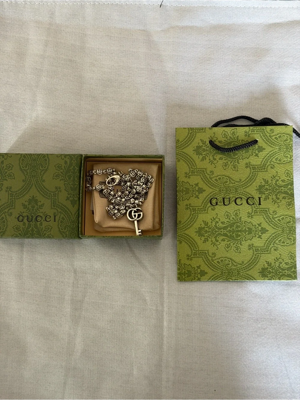 Gucci key pendant