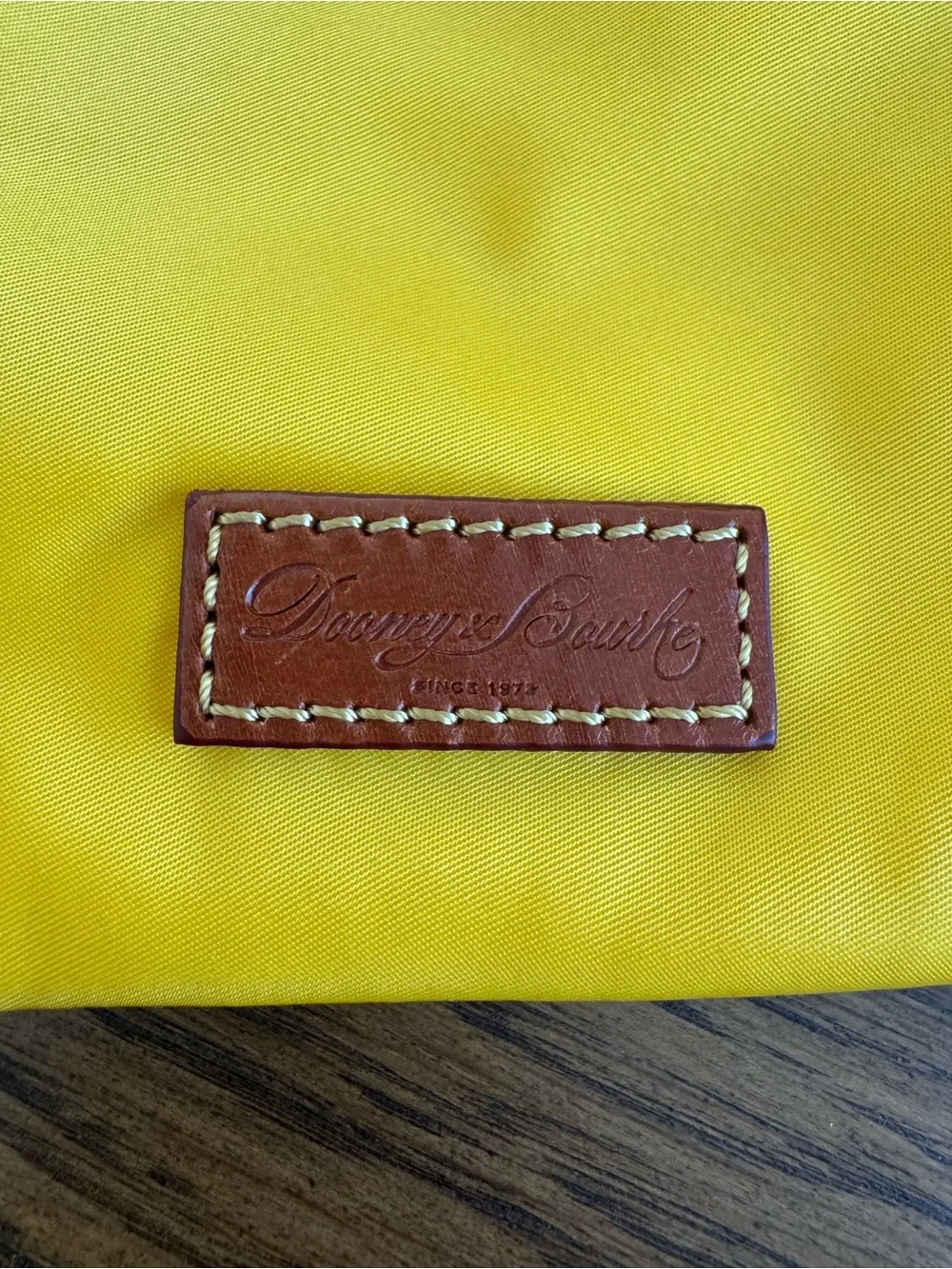 Dooney & Bourke compact yellow