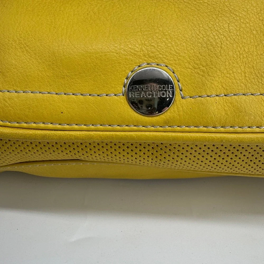 Reaction Kenneth Cole emblem from side
