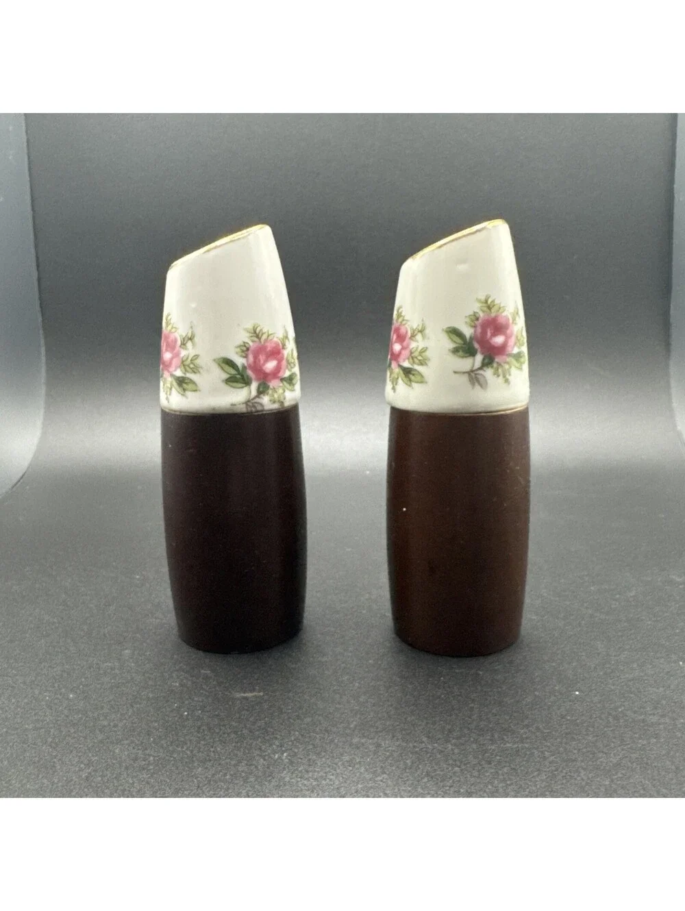 N/A enhance your dining experience with these vintage nevco teak wood and floral porcelain salt and pepper shakers  beautifully crafted in the mid