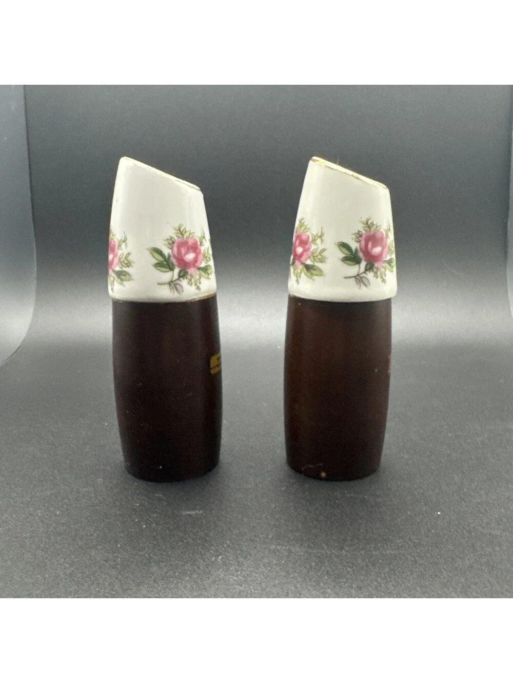 N/A enhance your dining experience with these vintage nevco teak wood and floral porcelain salt and pepper shakers  beautifully crafted in the mid