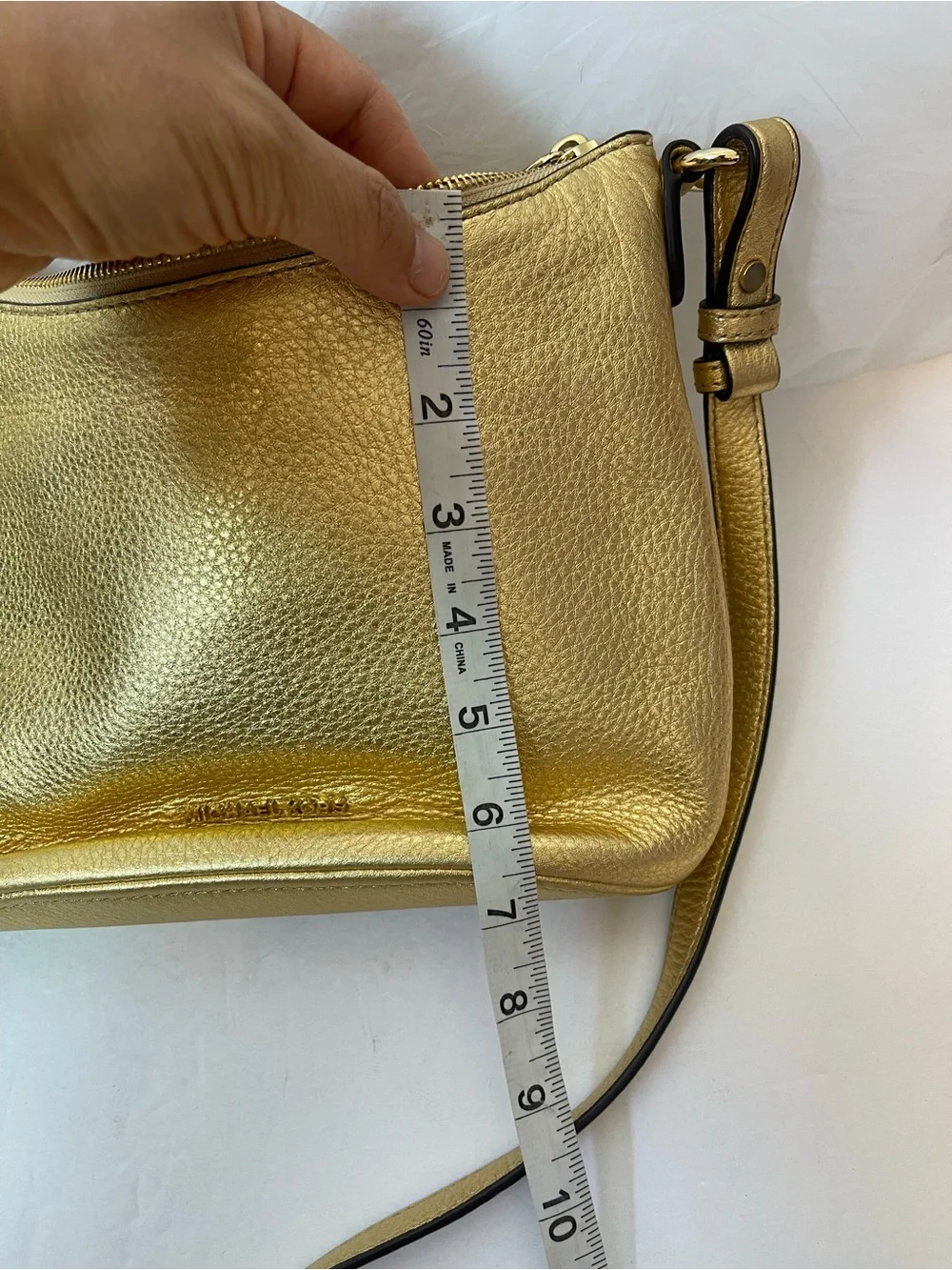 Michael Kors Gold leather hobo crossbody bag.
